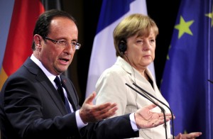 German Chancellor Angela Merkel (R) and the new French president Francois Hollande arrive to address a press conference at the German Chancellery on May 15, 2012 in Berlin. Francois Hollande meets Angela Merkel for their first talks on the debt crisis as Greece's future in the eurozone appears uncertain before giving a news conference and sharing a working dinner. AFP PHOTO / JOHN MACDOUGALL